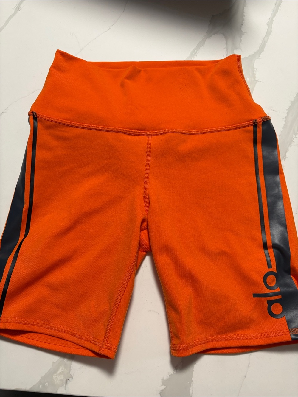 ALO Yoga Orange Bike Shorts with Black Side Stripe